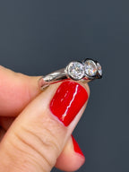 Platinum Three-Stone Diamond Bezel Ring
