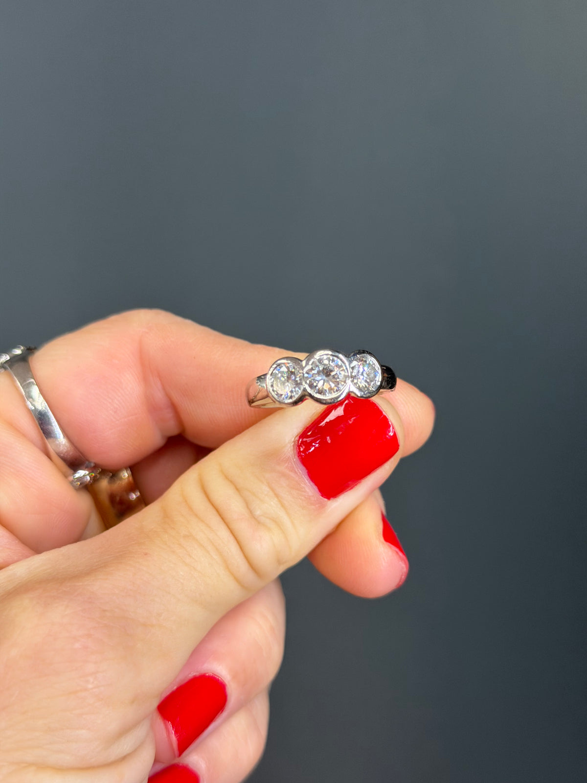 Platinum Three-Stone Diamond Bezel Ring